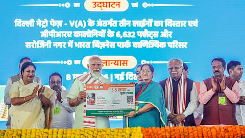 Prime Minister Narendra Modi with Union Minister of Housing and Urban Affairs Manohar Lal and Delhi CM Rekha Gupta during the inauguration and foundation stone laying ceremony of multiple development projects, New Delhi.