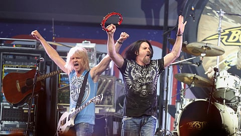 Tommy DeCarlo, lead singer of the group Boston, right, performs at the Boston Strong Concert: An Evening of Support and Celebration at the TD Garden, Thursday, May 30, 2013, in Boston.