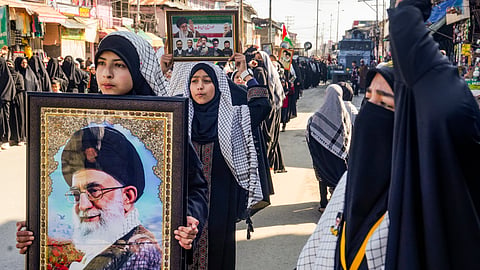 People take part in a Youm-e-Quds protest demonstration expressing solidarity with Palestinians amid the ongoing West Asia conflict, in Magam, Budgam district, Jammu and Kashmir, Friday, March 13, 2026.