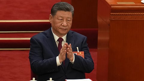Chinese President Xi Jinping applauds during the closing session of the National People's Congress (NPC) at the Great Hall of the People in Beijing, Thursday, March 12, 2026.