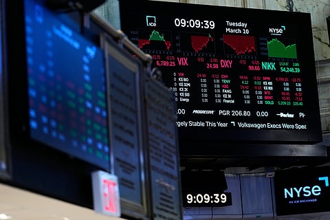 Screens display financial information on the floor at the New York Stock Exchange in New York.