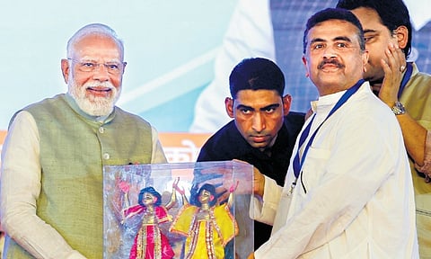PM Narendra Modi with Bengal Assembly Leader of Opposition Suvendu Adhikari in Kolkata