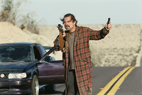 This image released by Warner Bros. Pictures shows Leonardo DiCaprio in a scene from "One Battle After Another."