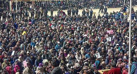People gather during a protest demanding inclusion under the Sixth Schedule of the Constitution, in Leh, Ladakh, Monday, March 16, 2026.