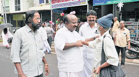 Sitting MLA T J Vinod seeking votes.