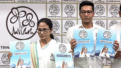 All India Trinamool Congress Supremo and West Bengal Chief Minister Mamata Banerjee releases party's manifesto for the upcoming West Bengal Assembly elections, in Kolkata on Friday. TMC party MP and general secretary Abhishek Banerjee also seen.
