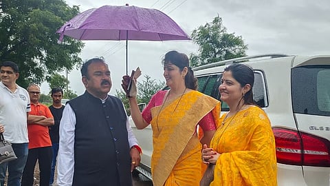 Self-styled godman Ashok Kharat with Maharashtra Women’s Commission Chairperson Rupali Chakankar.