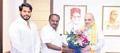 Union Minister HD Kumaraswamy greets Union Home Minister Amit Shah
in New Delhi. JDS leader Nikhil Kumaraswamy accompaied his father