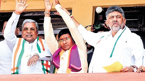 Congress candidate for Bagalkot bypoll, Umesh Meti, flanked by CM Siddaramaiah and DCM DK Shivakumar