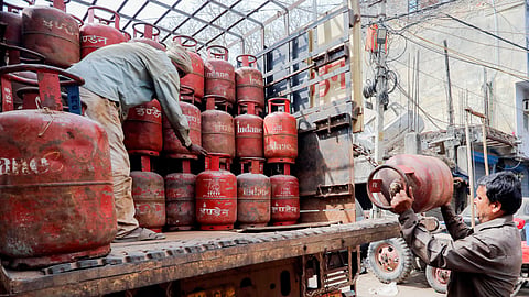 Workers load LPG cylinders amid a reported ongoing LPG supply shortage in Uttarakhand on March 14, 2026.