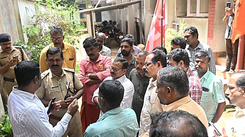 Workers stage a protest in front of the Vijayamohini Mills on Wednesday by blocking the entry of the company management.