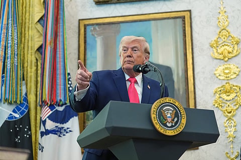 President Donald Trump speaks with reporters during the swearing in for Homeland Security Secretary Markwayne Mullin in the Oval Office of the White House, Tuesday, March 24, 2026, in Washington.