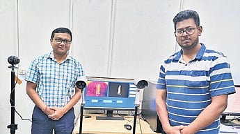 Prof Ari and research scholar Junaid with their smart surveillance system