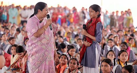 Delhi Chief Minister Rekha Gupta with students during 'Kanya Pujan' on the occasion of 'Durga Ashtami', at Sarvodaya Vidyalaya in Shalimar Bagh, New Delhi on Thursday.