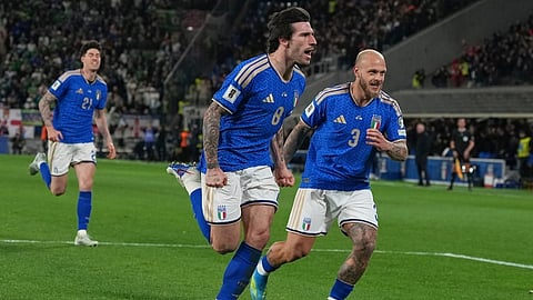 Italy's Federico Dimarco, right, celebrates with teammate Sandro Tonali who scored his side's first goal during the World Cup qualifying play-off soccer match between Italy and Northern Ireland on March 26, 2026.