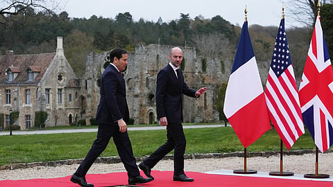 France's Foreign Affairs Minister Jean-Noel Barrot, right, greets U.S. Secretary of State Marco Rubio as he arrives at the G7 Foreign Ministers' meeting with partner countries in Cernay-la-Ville outside Paris, France, Friday, March 27, 2026.