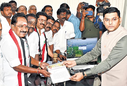 Sellur K Raju and others handing over the petition to the Madurai district election officer on Sunday.