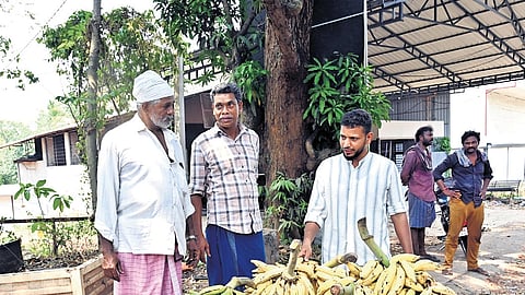 Residents of Vengara in Malappuram engaging in election discussions
with a trader