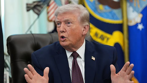 President Donald Trump answers questions from reporters after signing an executive order in the Oval Office of the White House Tuesday, March 31, 2026, in Washington.