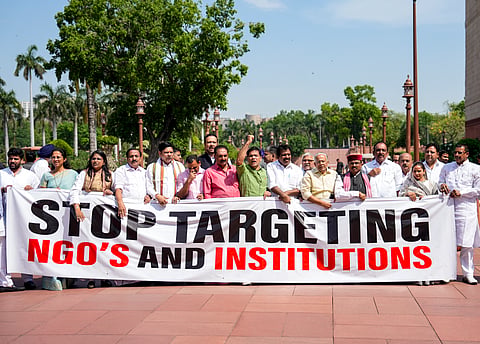 Opposition MPs Hibi Eden, Prashant Padole, Dean Kuriakose, Supriya Sule, and others, stage a protest during the second part of the Budget session of Parliament, in New Delhi, Wednesday, April 1, 2026.