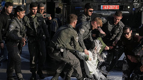 Police disperse demonstrators during a protest against the decision by Israel's parliament to approve the death penalty for Palestinians convicted of murdering Israelis, in Jerusalem Tuesday, March 31, 2026.