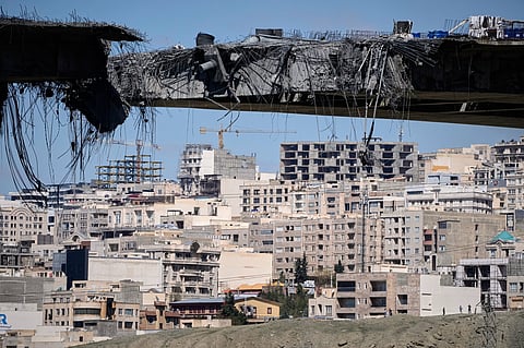 A bridge struck by U.S. airstrikes on Thursday is seen in the town of Karaj, west of Tehran, Iran, Friday, April 3, 2026.