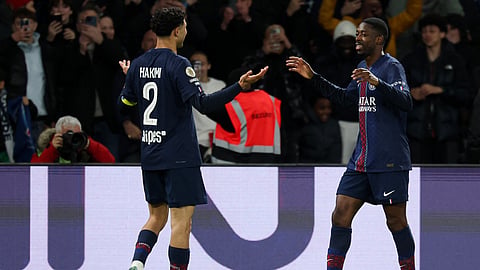 PSG's Ousmane Dembele (R) celebrates with tammate Achraf Hakimi after scoring his team's first goal during the French L1 football match between Paris Saint-Germain and Toulouse FC on April 3, 2026.