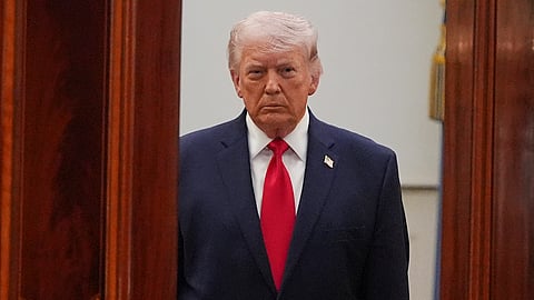 US President Donald Trump arrives from the Blue Room to speak about the Iran war from the Cross Hall of the White House on Wednesday, April 1, 2026, in Washington.