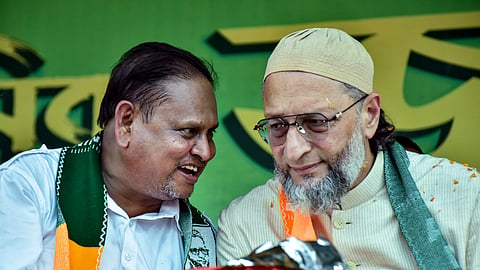 AIMIM President and MP Asaduddin Owaisi, right, in conversation with Aam Janata Unnayan Party (JUP) chief and candidate for Nowda constituency, Humayun Kabir, during a public rally in support of the candidate ahead of the West Bengal Assembly Election, in Murshidabad district, Wednesday, April 1, 2026.