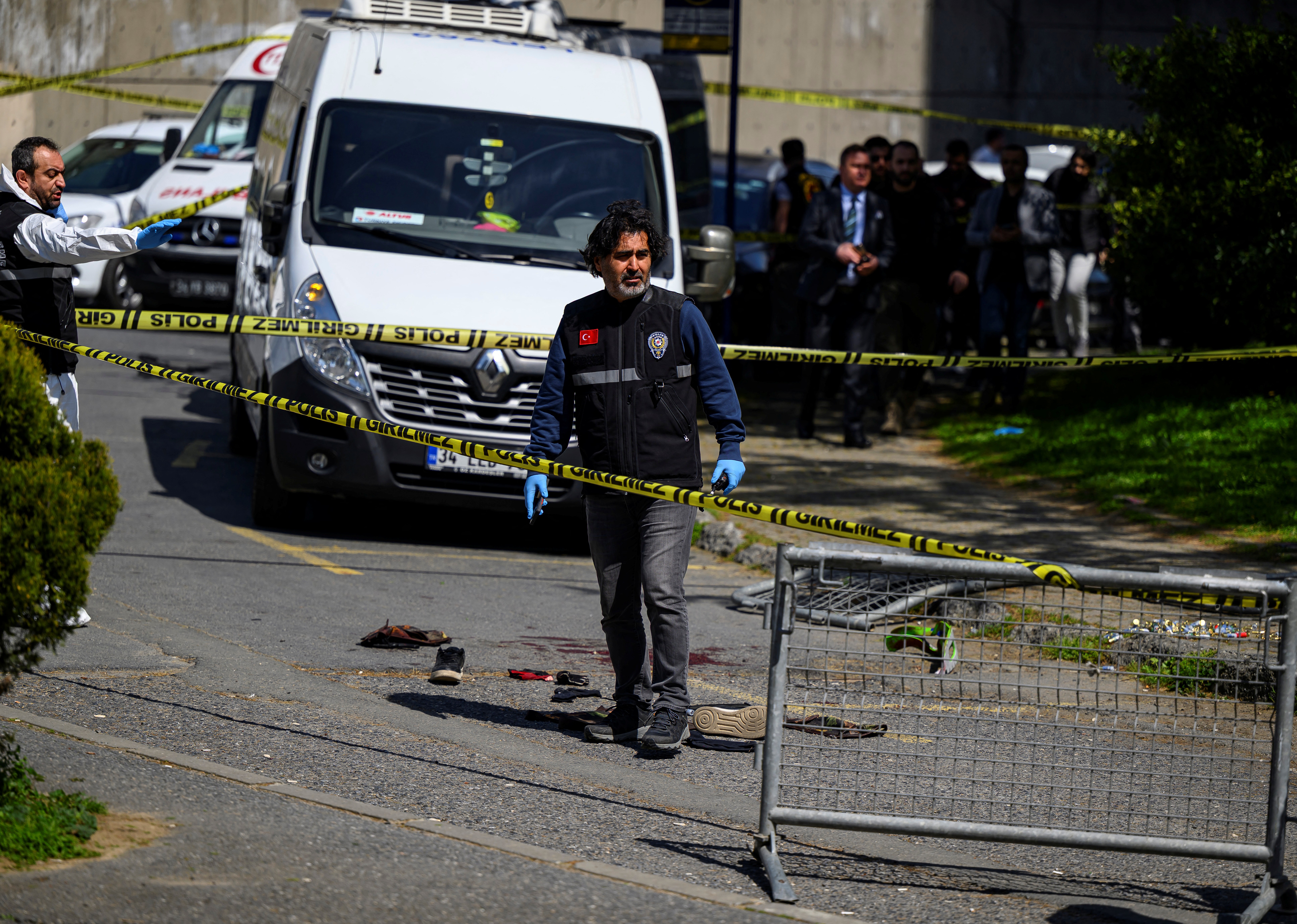 Police officials gather near bloodstained clothing outside The Israeli Consulate in Istanbul on April 7, 2026, following a shootout between gunmen and police.
One gunman was killed and two others were wounded in a shootout with police outside the Israeli consulate in Istanbul, the local governor said, adding two officers were lightly wounded.