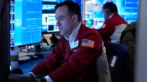 Robert Greason works on the floor at the New York Stock Exchange in New York, Tuesday, April 7, 2026.