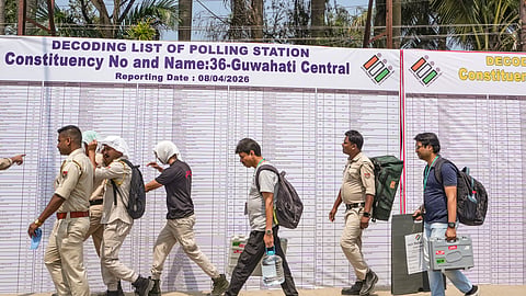 Polling officials after collecting election materials from a distribution centre, leave for their respective booths on the eve of voting in the Assam Assembly elections, in Guwahati, Wednesday, April 8, 2026