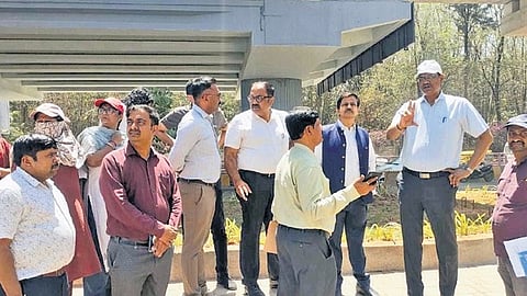 Bengaluru South City Commissioner K N Ramesh and officials inspect a junction on Bannerghatta Main Road on Wednesday.