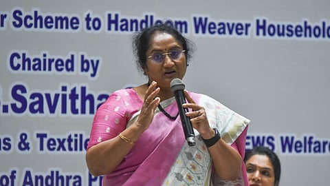 Handlooms & Textiles minister S Savitha addressing the officials on implementation of free power scheme to handloom weaver households and powerloom units at a hotel in Vijayawada on Thursday.