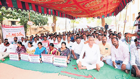 BRS leader T Harish Rao participates in a dharna staged by electricity employees, demanding resolution of their long-standing issues, in Siddipet on Monday.