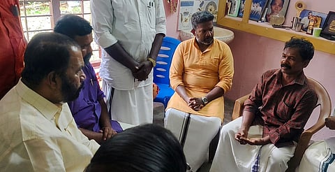 General Education Minister V Sivankutty consoles the family of Nithin Raj during a visit to their residence in Thiruvananthapuram on Sunday