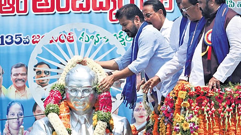 Chief Minister A Revanth Reddy garlands a statue of Dr BR Ambedkar on his 135th birth anniversary, at Lower Tank Bund in Hyderabad.