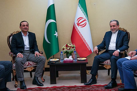 In this photo released by the Iranian Foreign Ministry, Iranian Foreign Minister Abbas Araghchi, right, meets with Pakistan's Army Chief Field Marshal Gen. Asim Munir in Tehran, Wednesday, April 15, 2026.