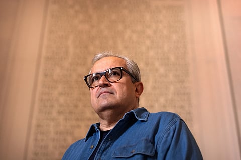 Iranian expatriate Nik Kowsar poses for a photograph at the Lincoln Memorial, March 31, 2026, in Washington.
