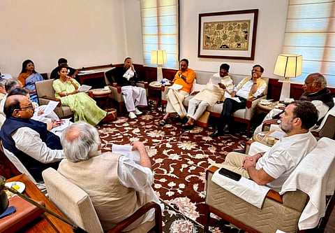 In this image received on April 16, 2026, Congress President and Rajya Sabha LoP Mallikarjun Kharge and Congress MP and Lok Sabha LoP Rahul Gandhi during a meeting with INDIA alliance MPs, at the Parliament House, in New Delhi.