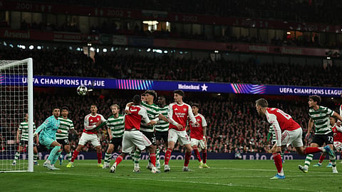 Arsenal's Leandro Trossard (R) shoots but fails to score during the UEFA Champions League quarter-final, second-leg football match between Arsenal and Sporting Lisbon at the Emirates Stadium in north London on April 15, 2026.