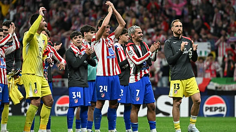 Atletico Madrid's Antoine Griezmann (2R) and teammates celebrate after winning the UEFA Champions League quarter final second leg football match between Club Atletico de Madrid and FC Barcelona on April 14, 2026.