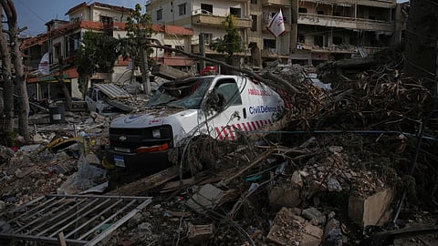 An ambulance belonging to Hezbollah's health unit lies amid the rubble of a medical center destroyed in an Israeli airstrike in JIbchit, Southern Lebanon, Friday, April 17, 2026.