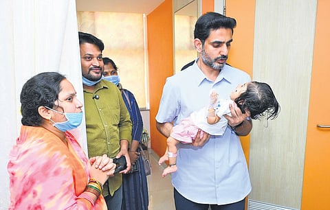 HRD and IT Minister Lokesh pays a visit to one-year-old Punarvika at a private hospital after she was given a Rs 16 crore life-saving injection