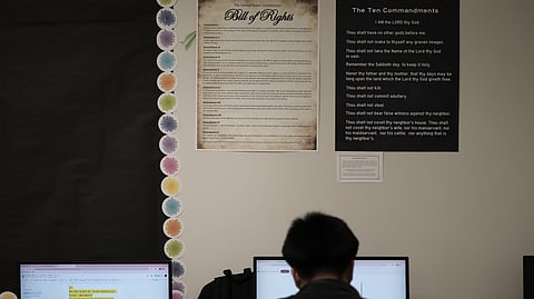 Students work under Ten Commandments and Bill of Rights posters on display in a classroom at Lehman High School in Kyle, Texas, Thursday, Oct. 16, 2025.
