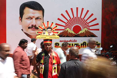 On the last day of the election campaign a DMK cader busy engaged in campaigning for his party at Gandhipuram in Coimbatore on Tuesday.
