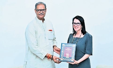 US consul general of Hyderabad Laura Williams receiving a book from deputy chief minister KV Singh Deo