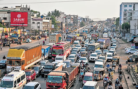 A massive traffic jam on NH 16 from Rasulgarh to Hansapal after a truck caught fire on Palasuni canal bridge in Bhubaneswar on Wednesday