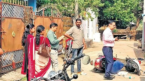 The teachers stand outside the accused’s house at Mahima Nagar