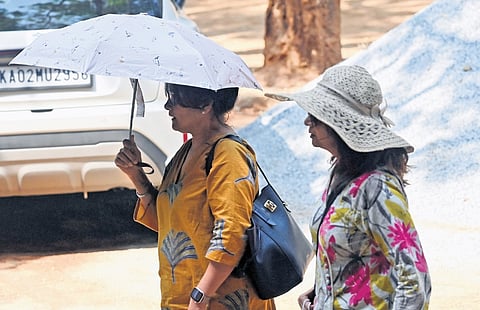 Two women brave the heat and step out in Bengaluru.